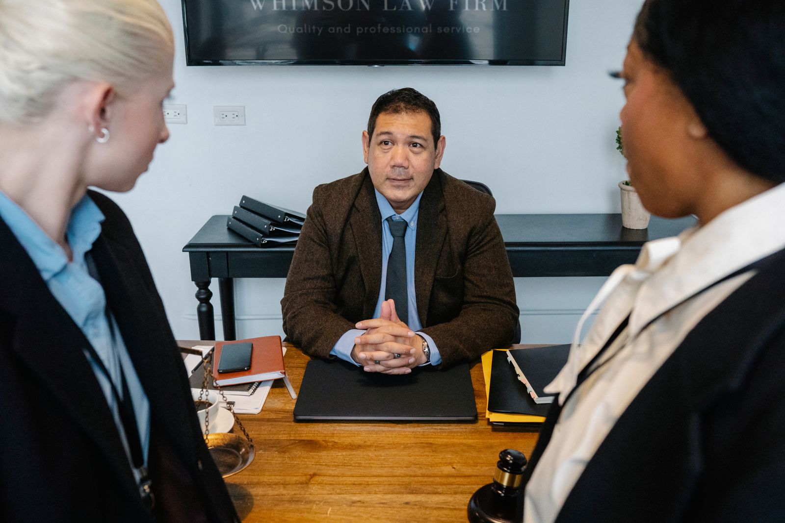 A legal team discussing a matter in an office